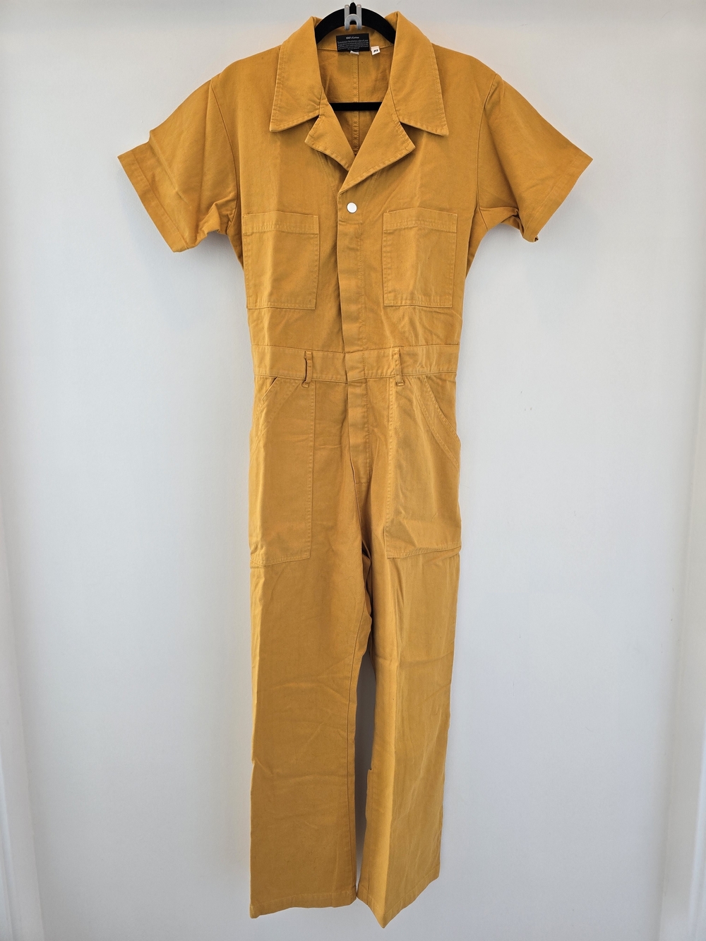 Big Bud Press Mustard Yellow Jumpsuit Label Close-Up